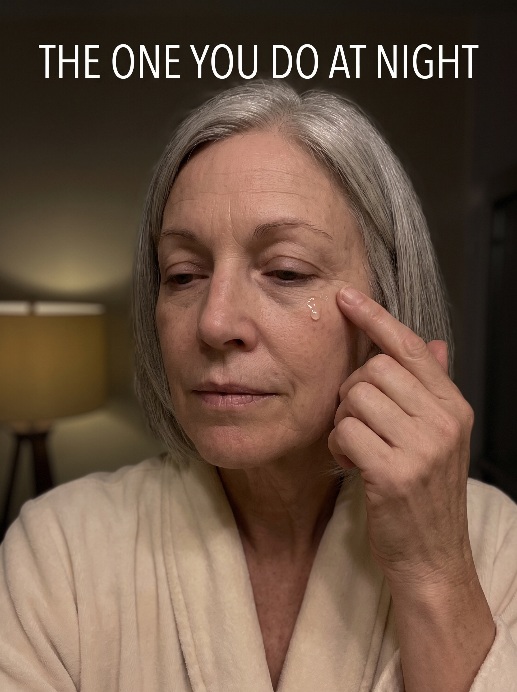 The same woman applying one drop of Venom Peptide Serum at the outer corner of her eye at night
